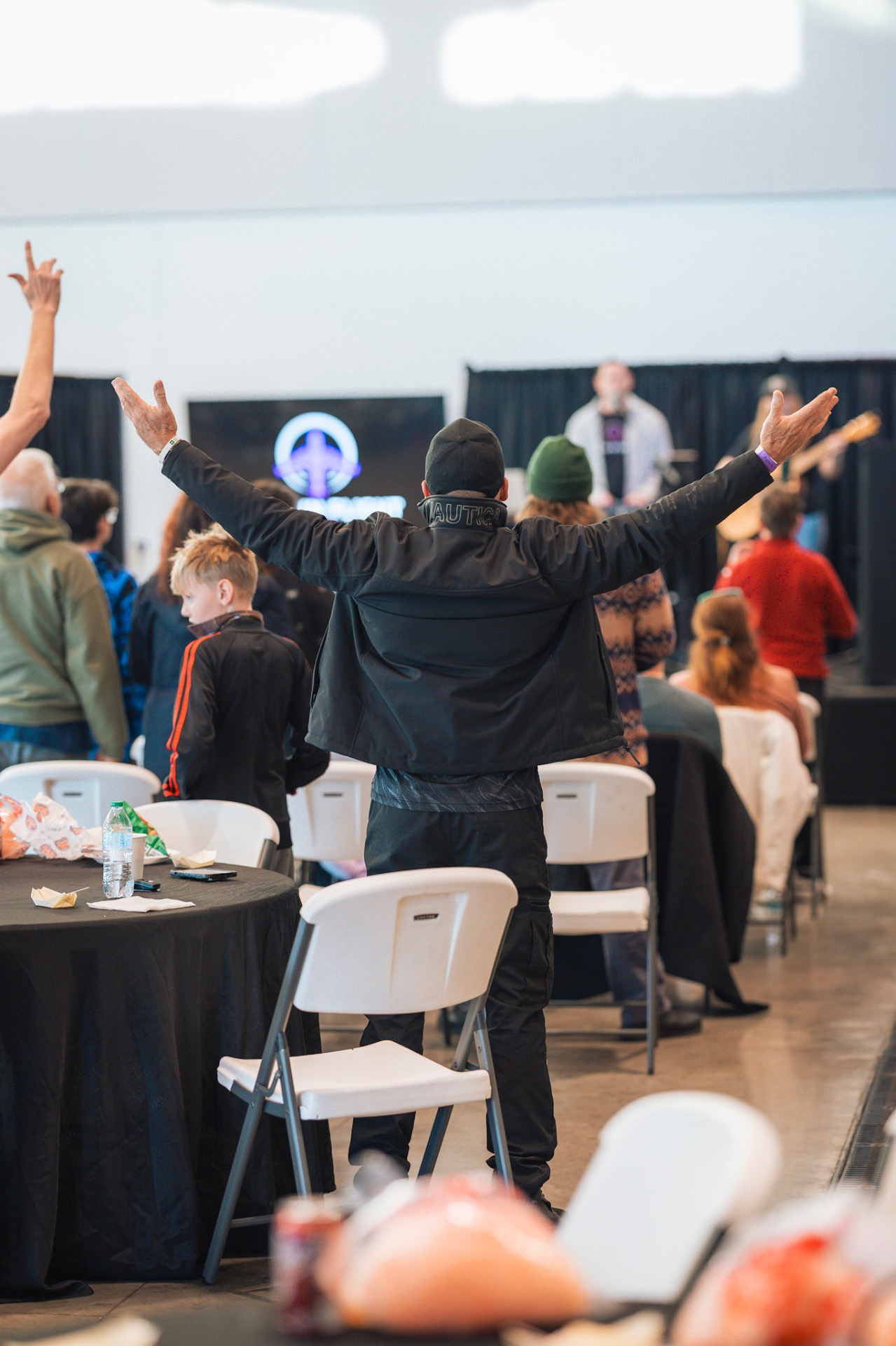 Worship with arms raised during the event