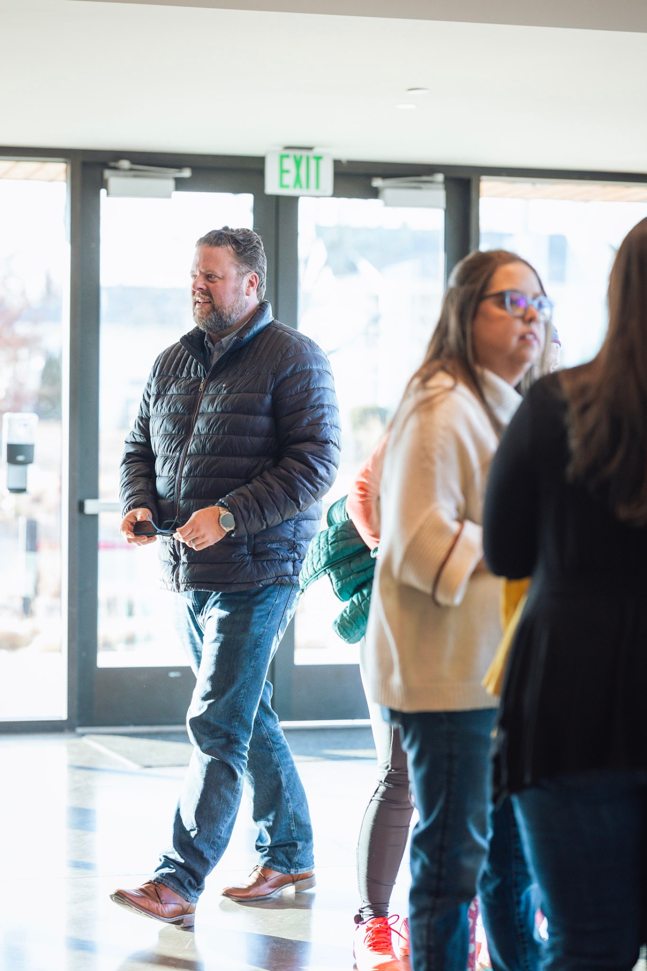 Guests arriving and connecting at a Faith In Flight event entrance